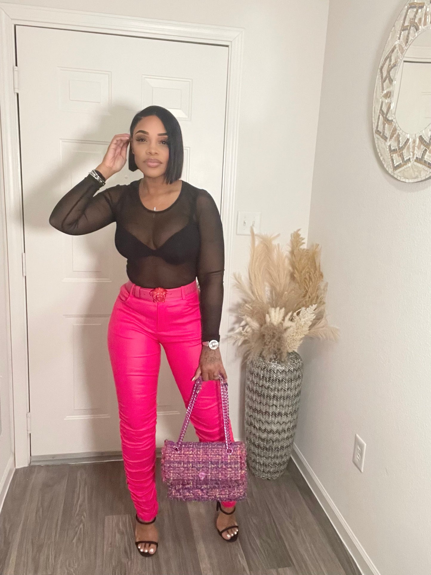 Hot pink faux leather stack pants