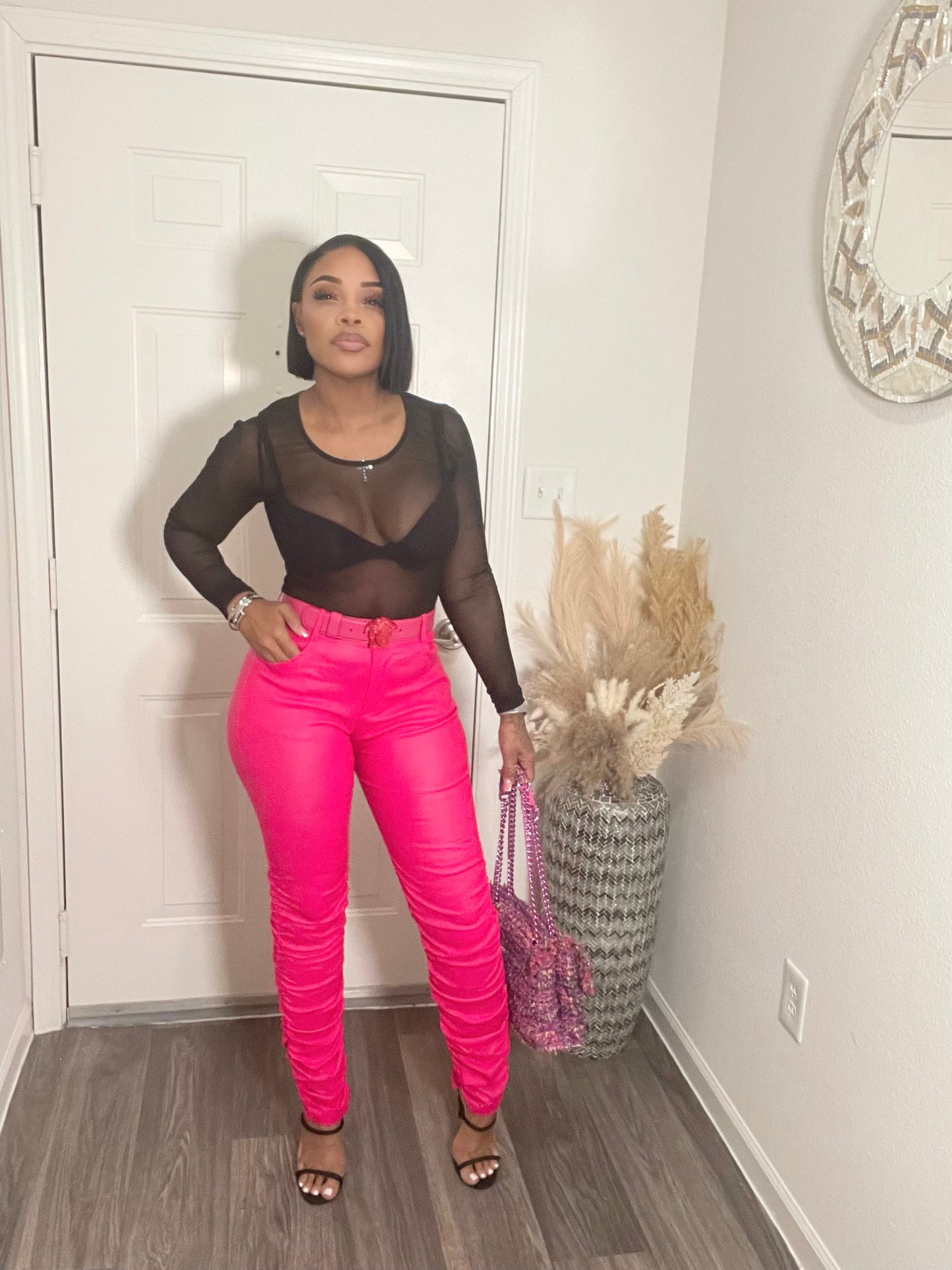 Hot pink faux leather stack pants